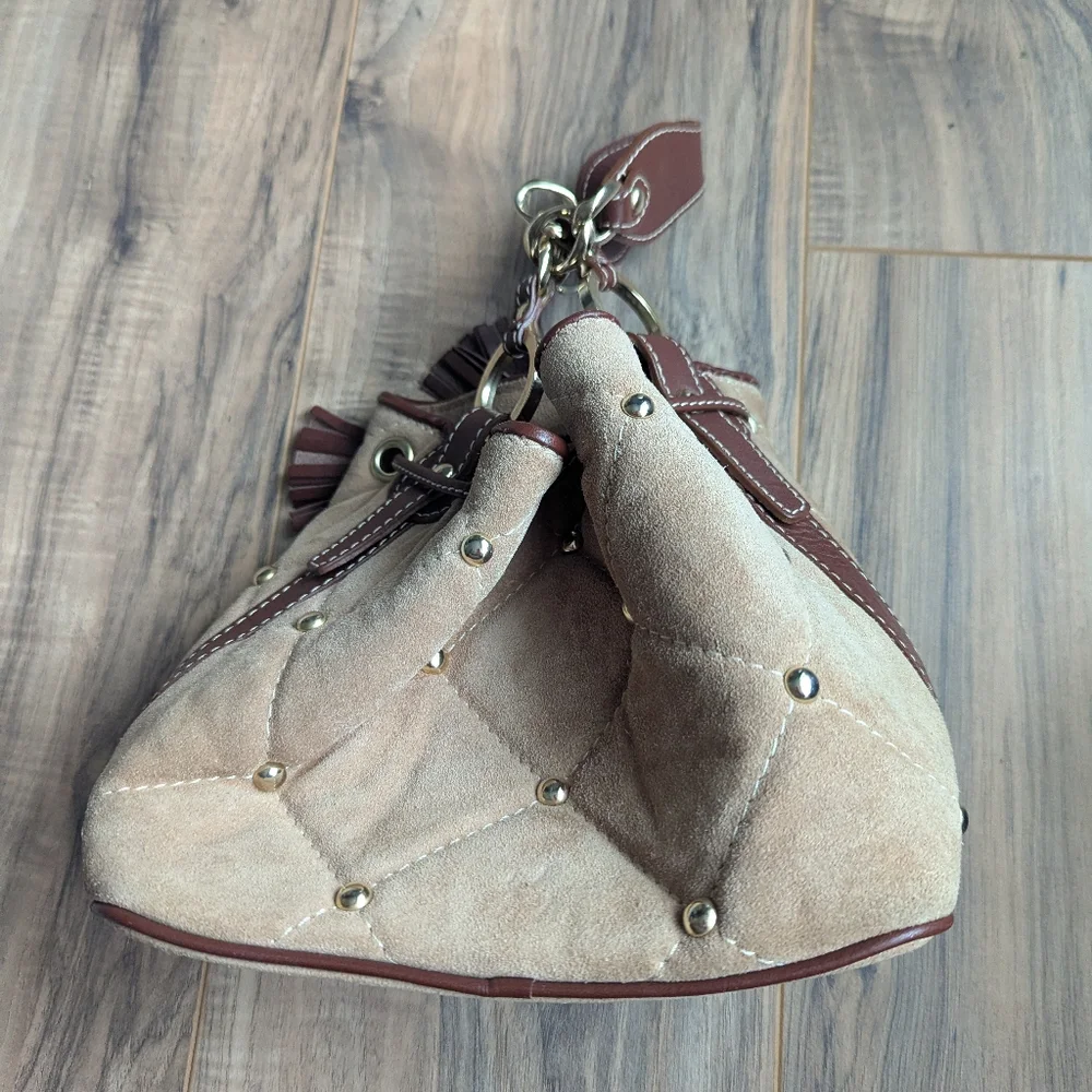 Claudia Firenze Leather Bucket Bag With Pull Top And Tassels.